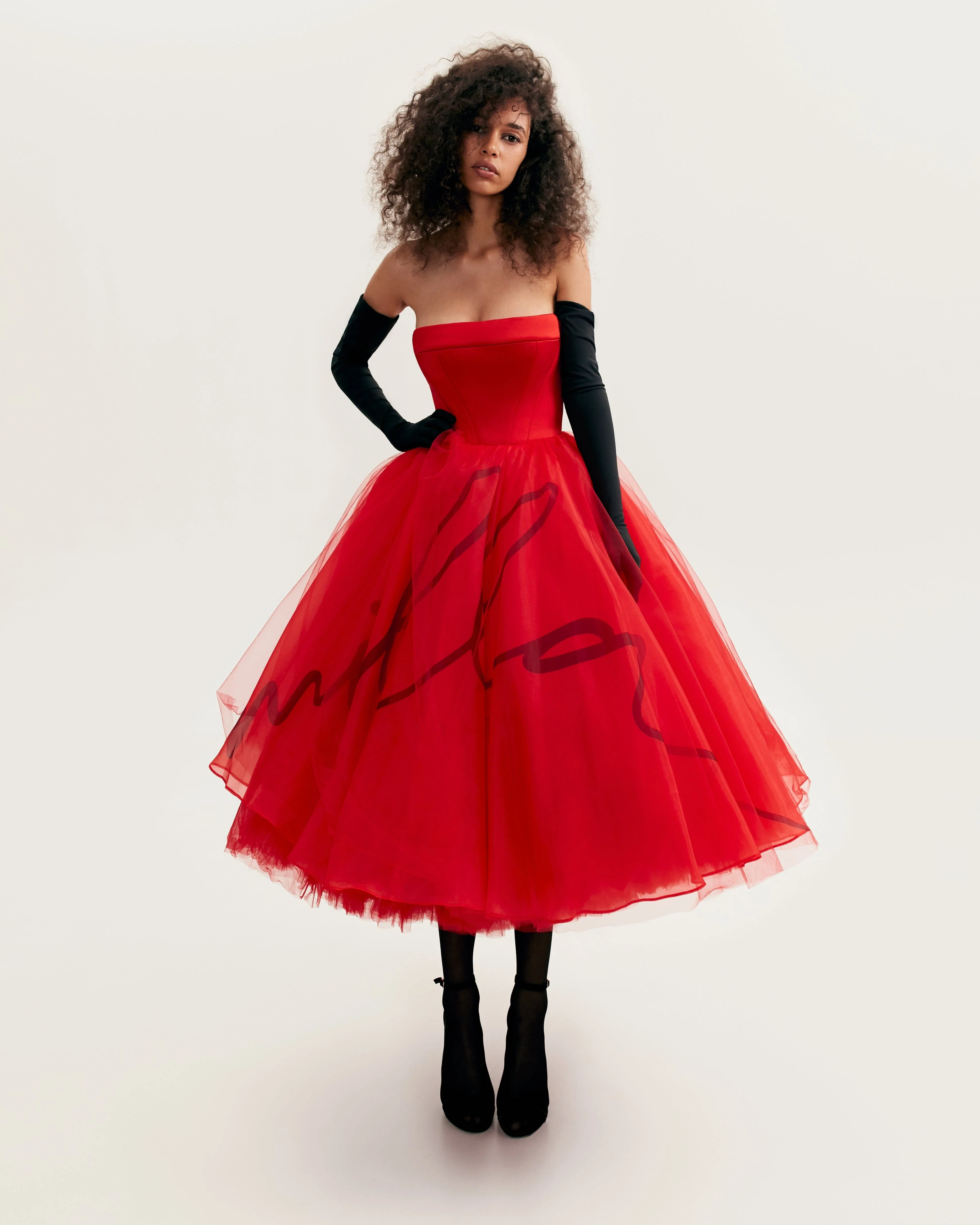 Dramatic red organza dress adorned with Milla's signature and black gloves, Xo Xo - Image 6